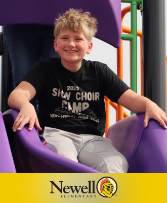  Smiling 5th Grader on the new purple slide at Newell Elementary.